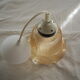 Suspension in a ribbed tulip shape, made of smoked glass.