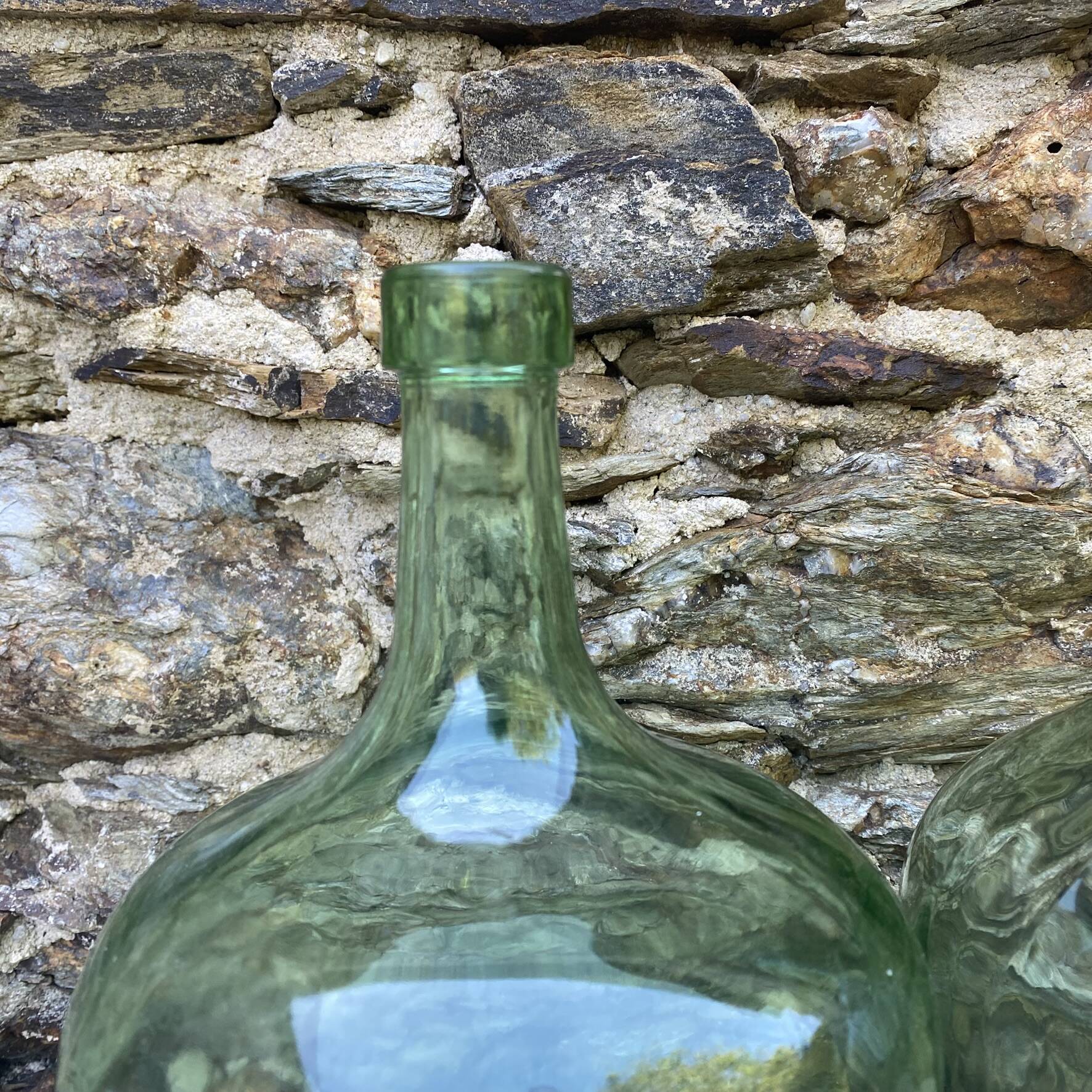 set of tinted glass demijohns