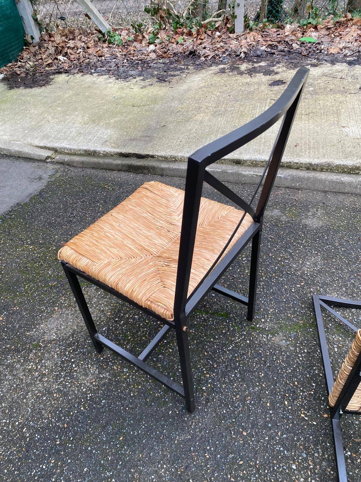 2 Scandinavian chairs with black steel and straw from IKEA Granas.