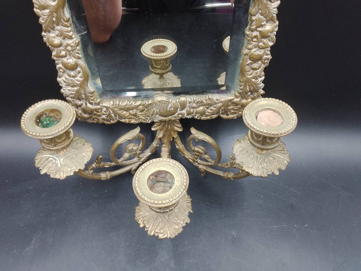 Repousse brass wall mirror with three candles, beveled glass, end of 19th century, double eagles