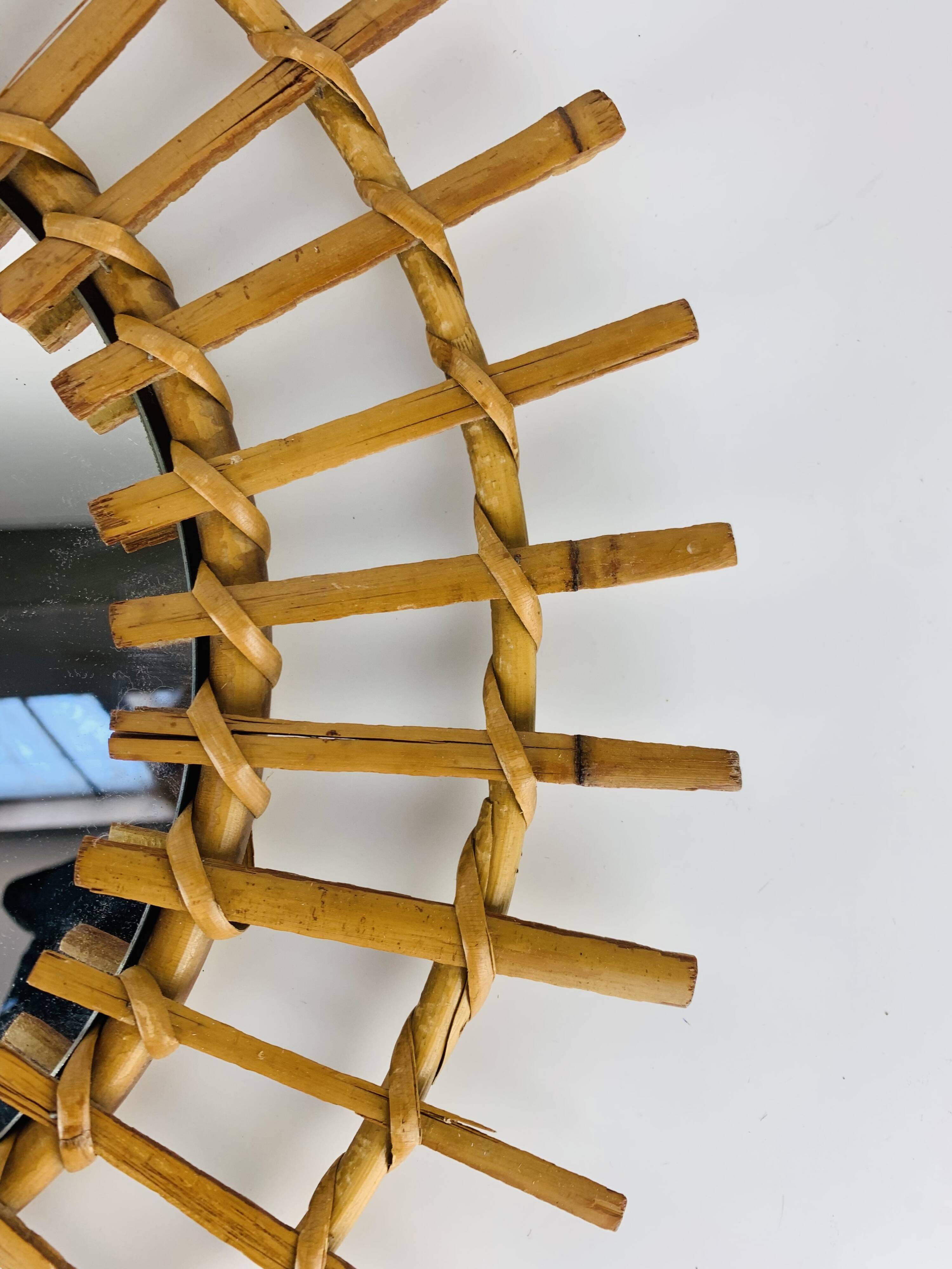 Vintage rattan sunburst mirror from the 1960s