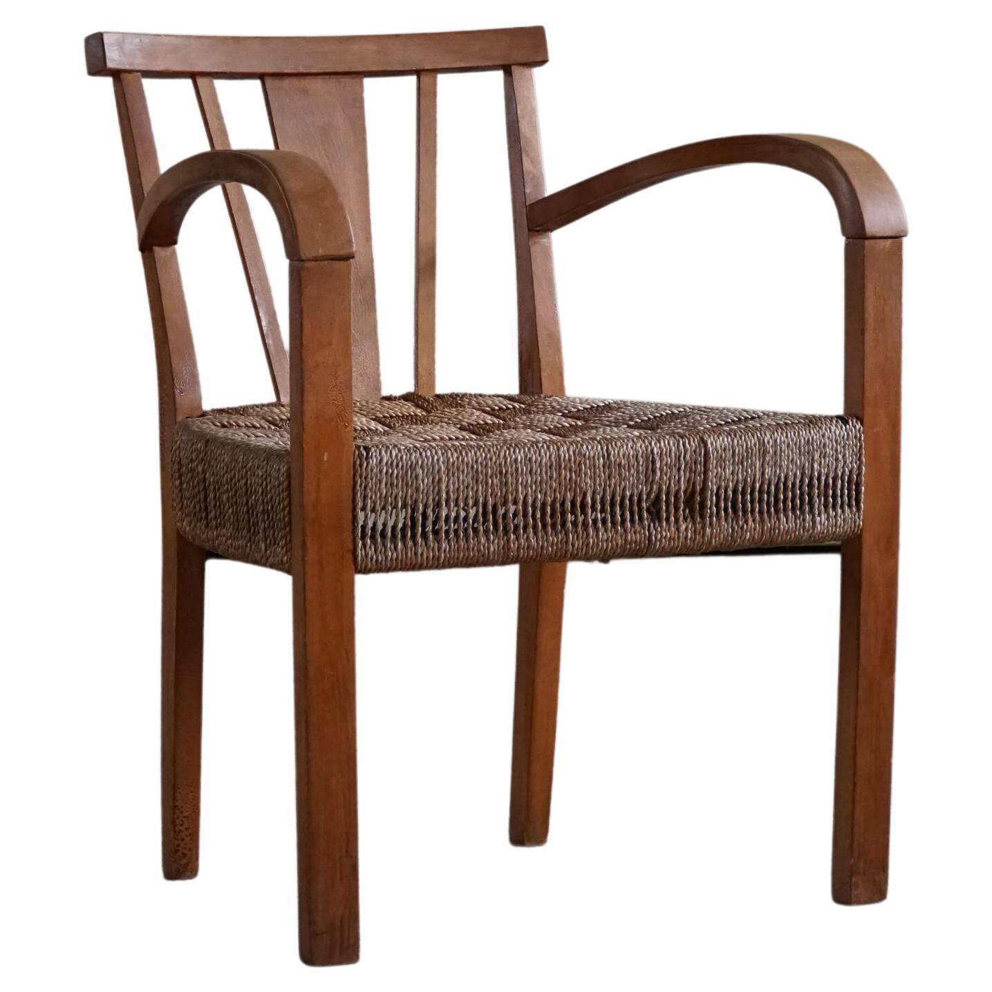 Modern Danish lounge chair in beech and paper cord, in the style of Frits Schlegel.