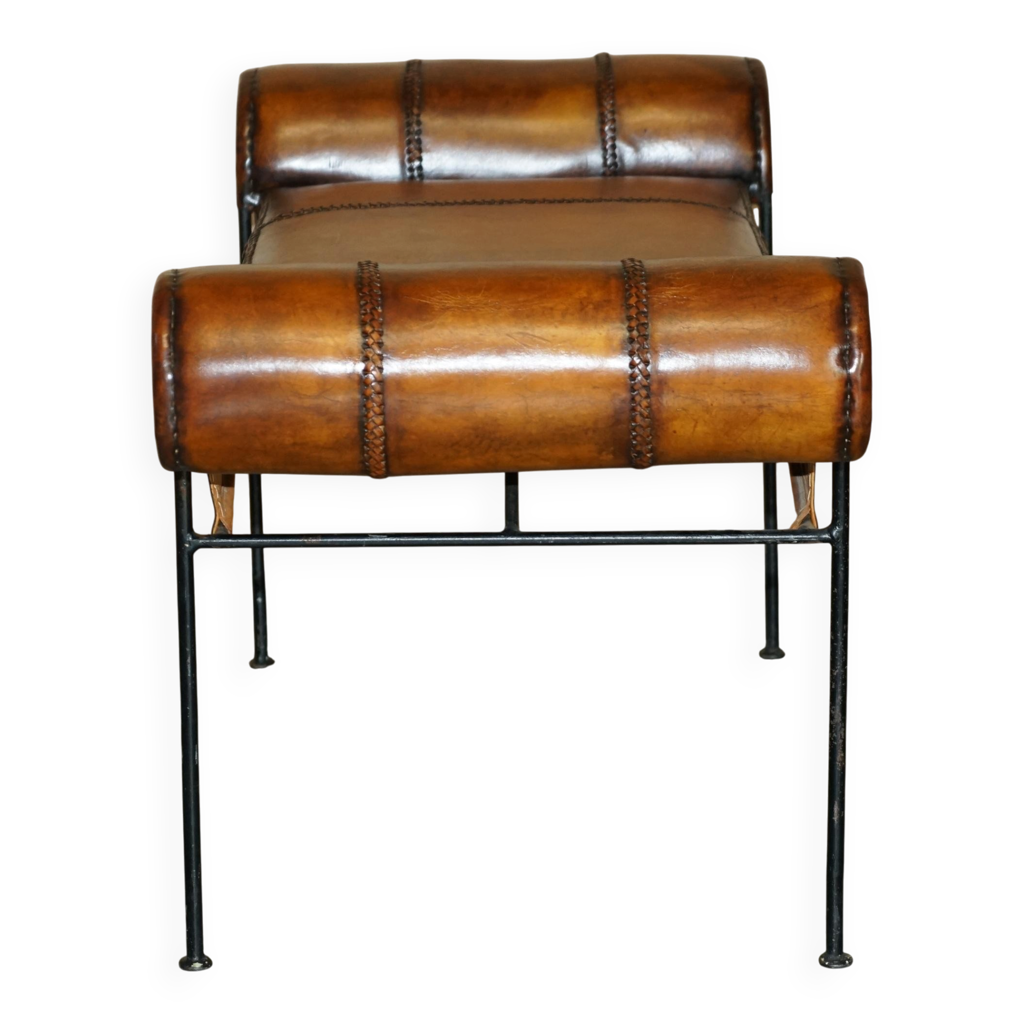 Vintage Spanish window bench in hand-stitched leather and restored iron.