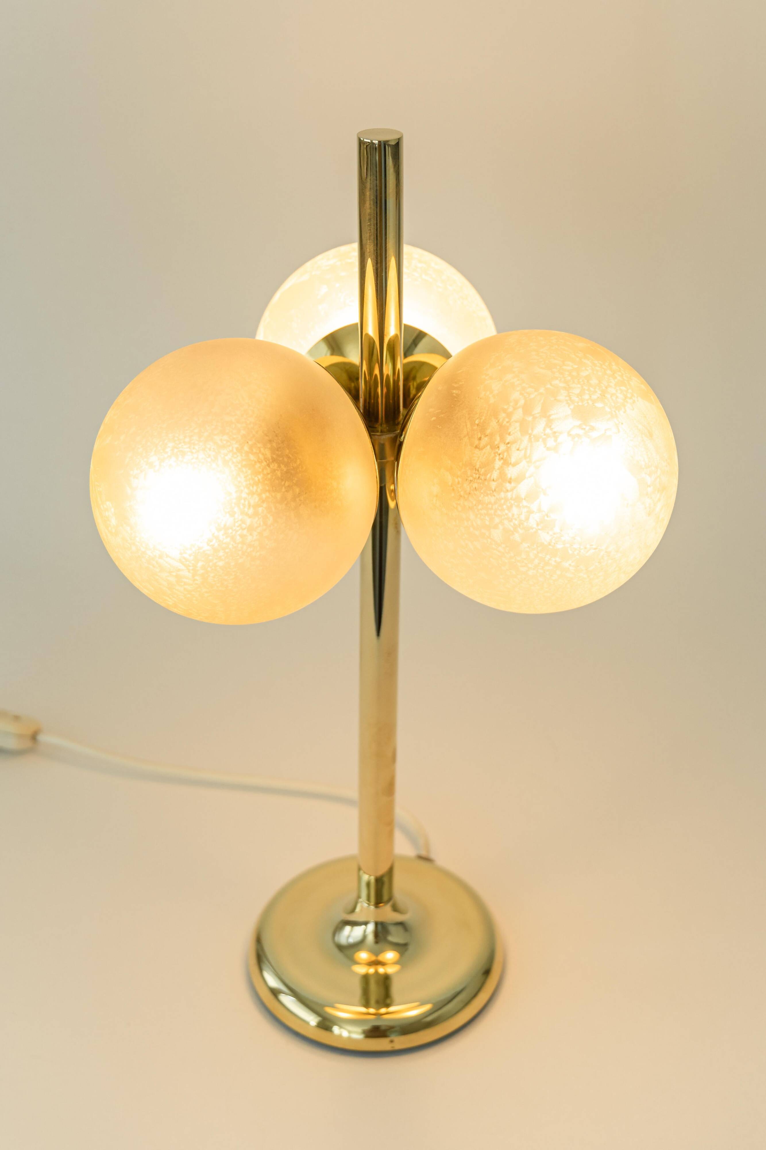 Pair of large brass table lamps by Kaiser, Germany, 1970s.