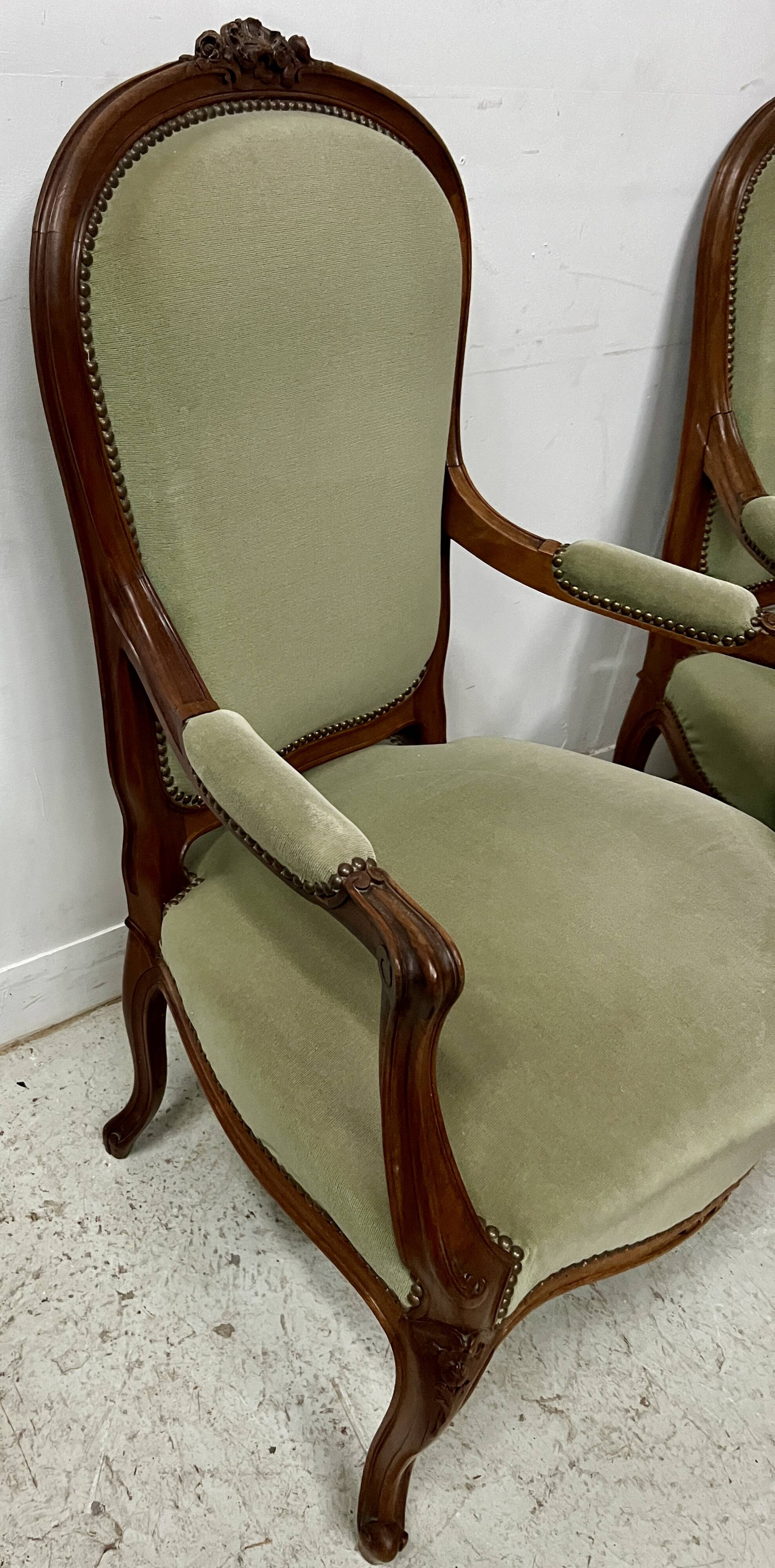 Pair of Louis XV style armchairs in solid walnut, 20th century.
