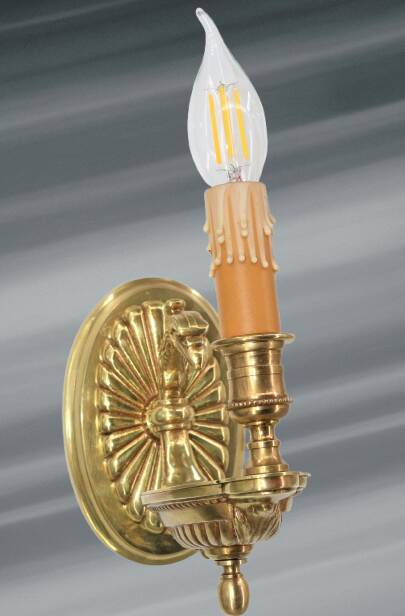 Pair of gilt bronze wall sconces in the Directoire style by Lucien Gau.