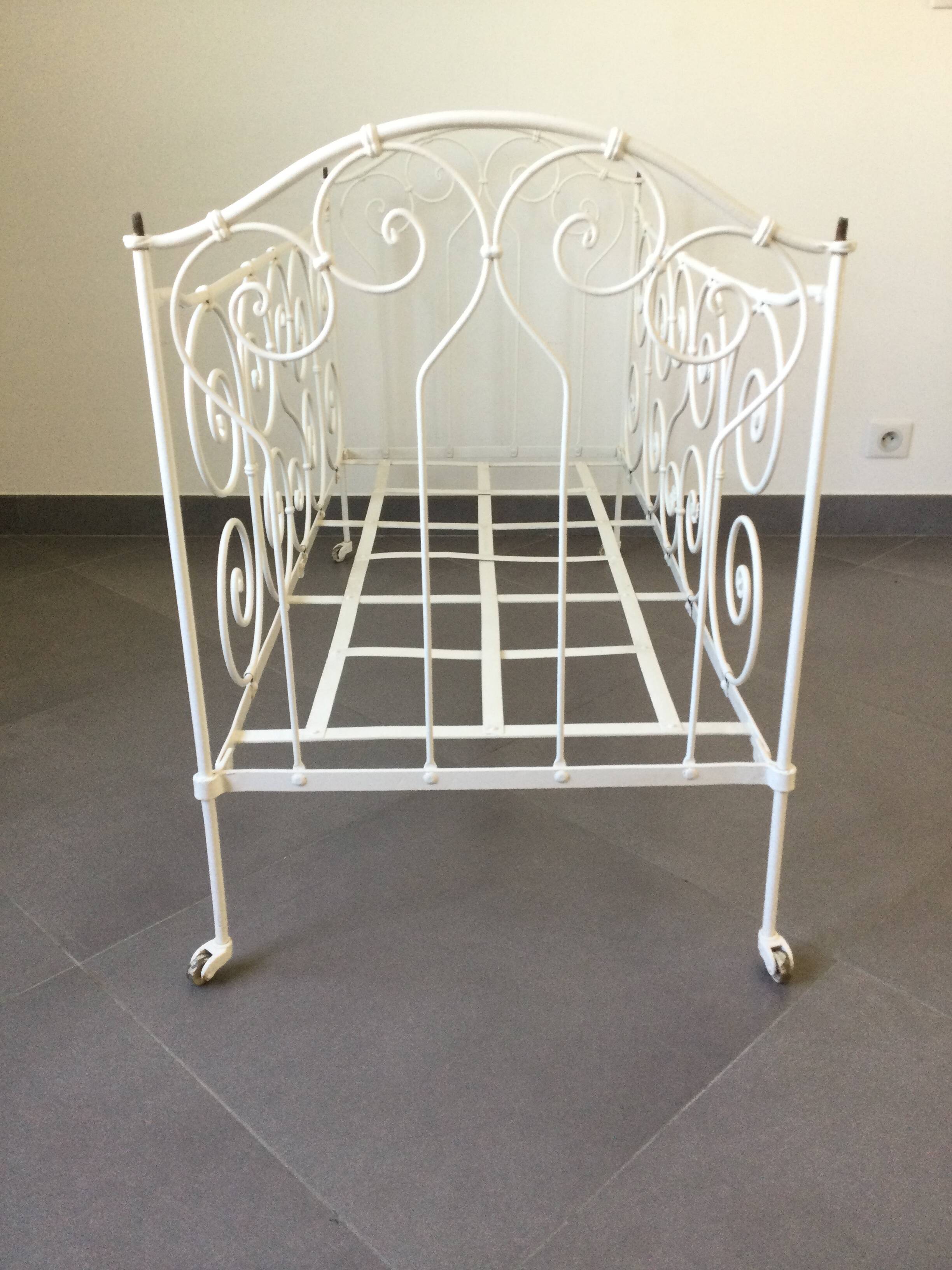 White wrought iron folding bed