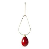 Hanging lamp with a brass frame in the shape of scales and a red-purple Murano glass diffuser.