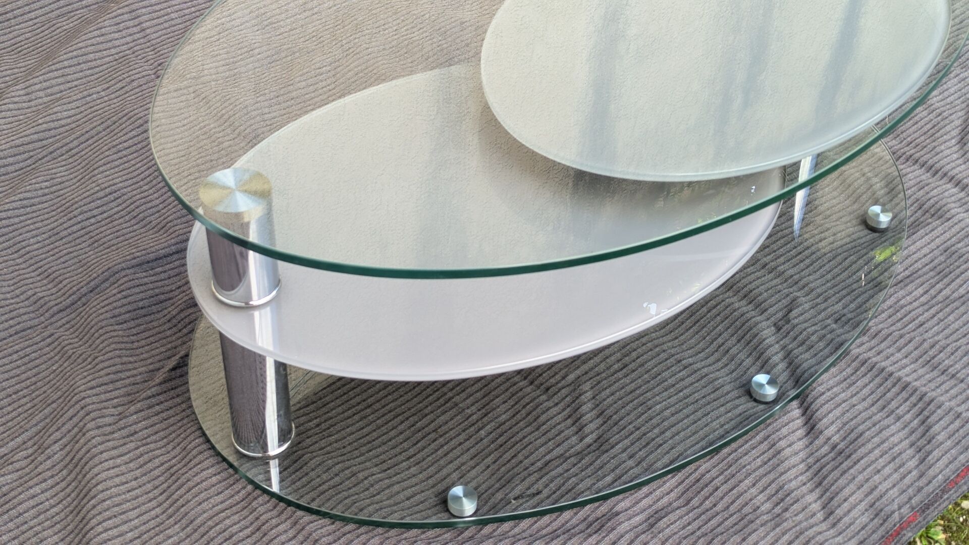 Coffee table with rotating glass tops by Antoine Motard.