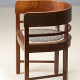 Central European armchair from the early 20th century with an inlaid backrest.