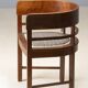Central European armchair from the early 20th century with an inlaid backrest.