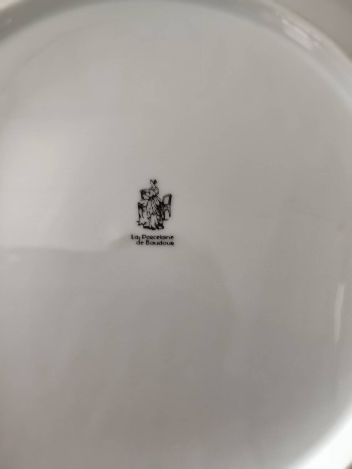 Set of 11 plates, Baudour porcelain