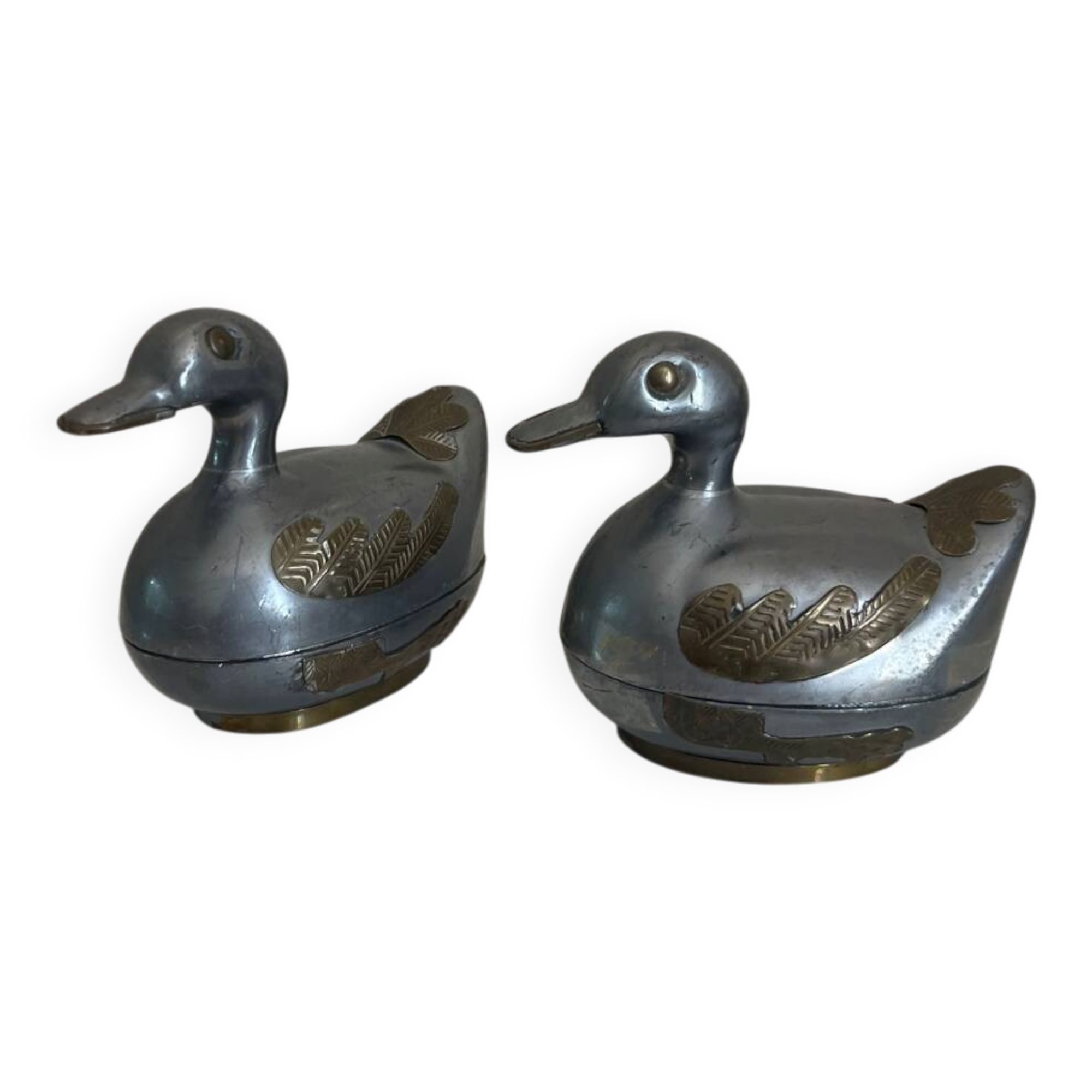 Pair of vintage decorative metal boxes in silver, shaped like ducks.