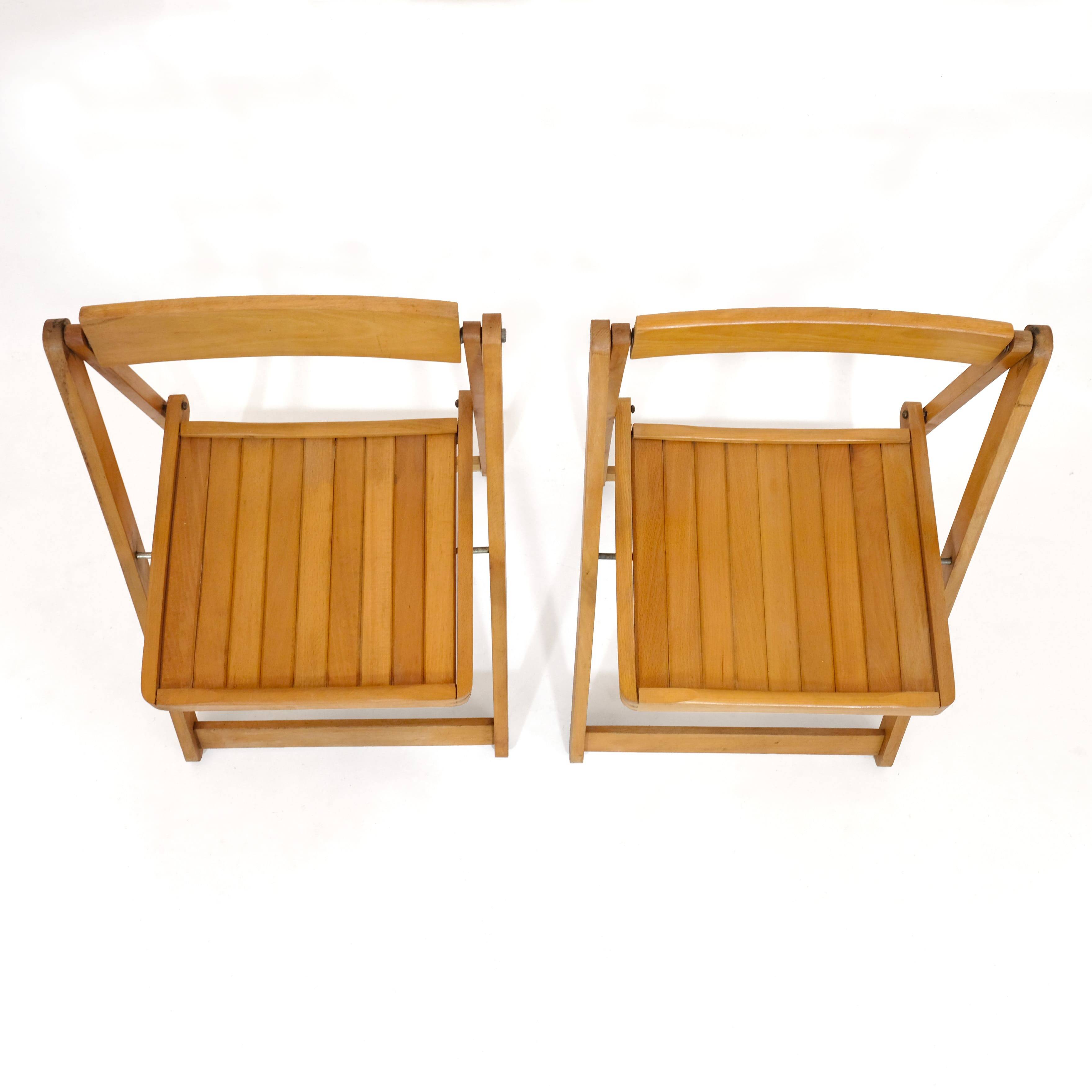 Pair of wooden folding chairs from the 80s.