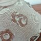 Moulded glass lampshade with floral decoration, granite texture.