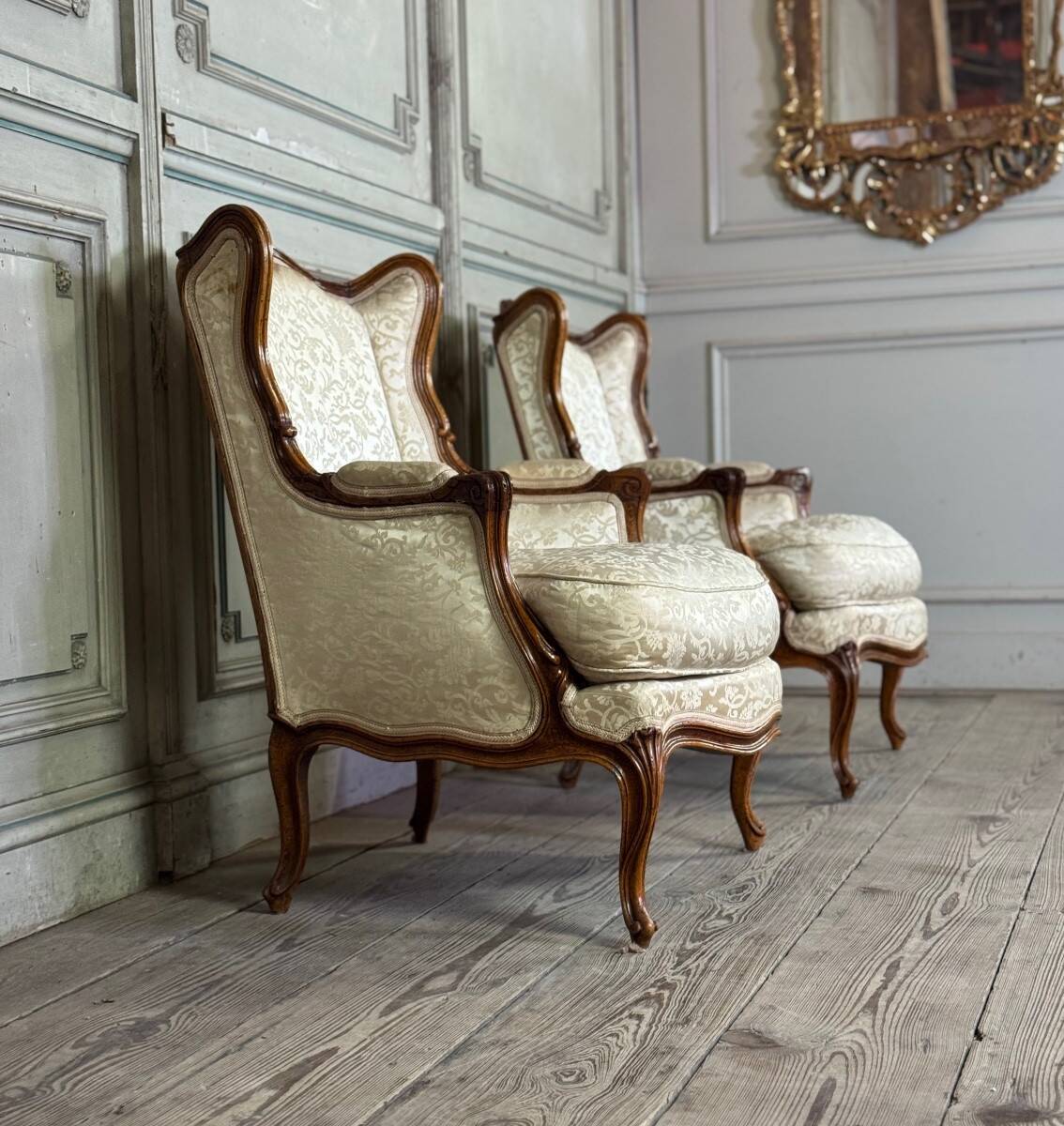 Pair of small Louis XV style wing chairs in carved walnut, Bosson stamp