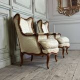 Pair of small Louis XV style wing chairs in carved walnut, Bosson stamp