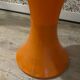 Orange tam-tam by Stamp with integrated pocket.