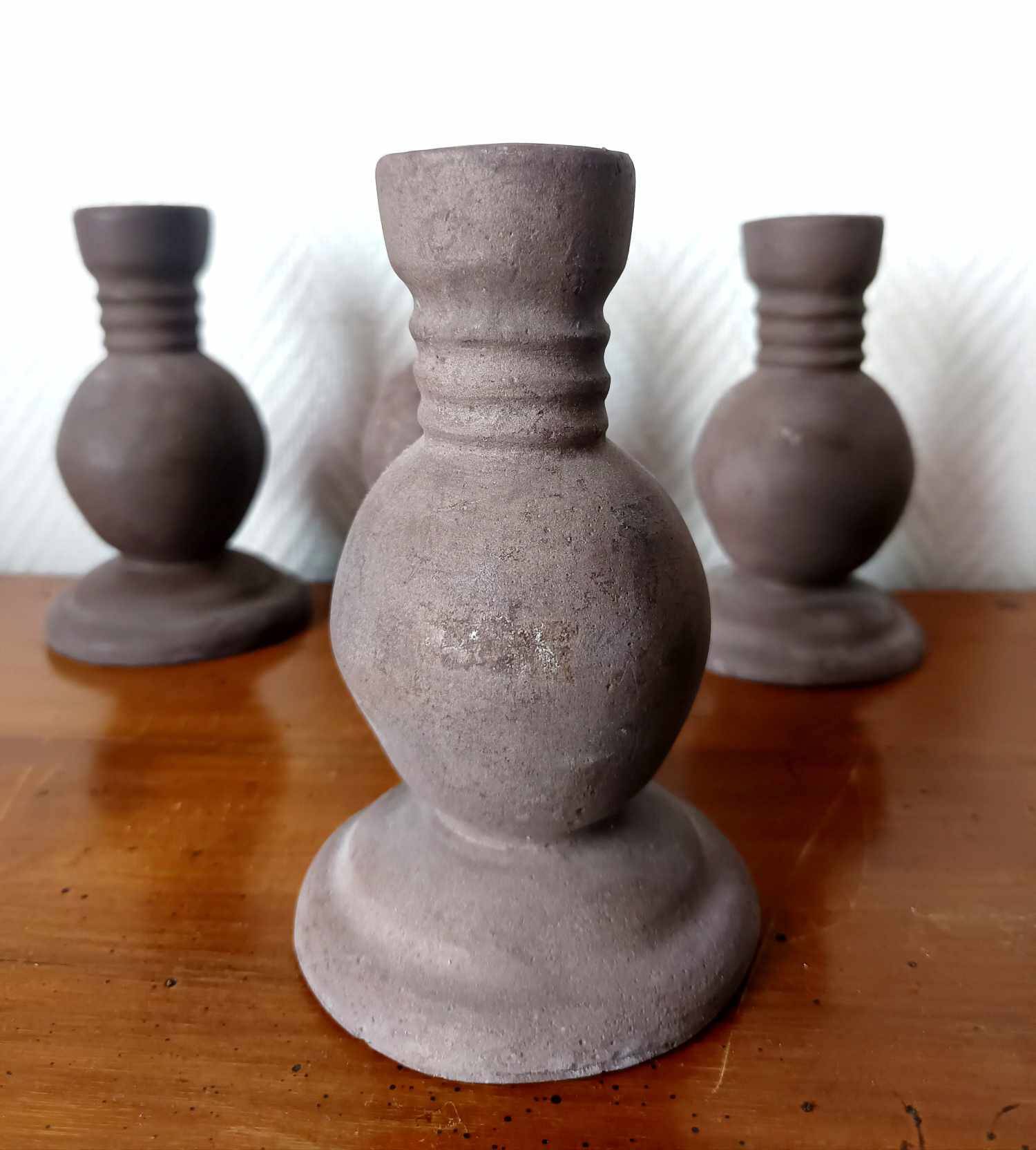 Four vintage handcrafted candle holders