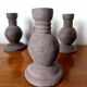 Four vintage handcrafted candle holders