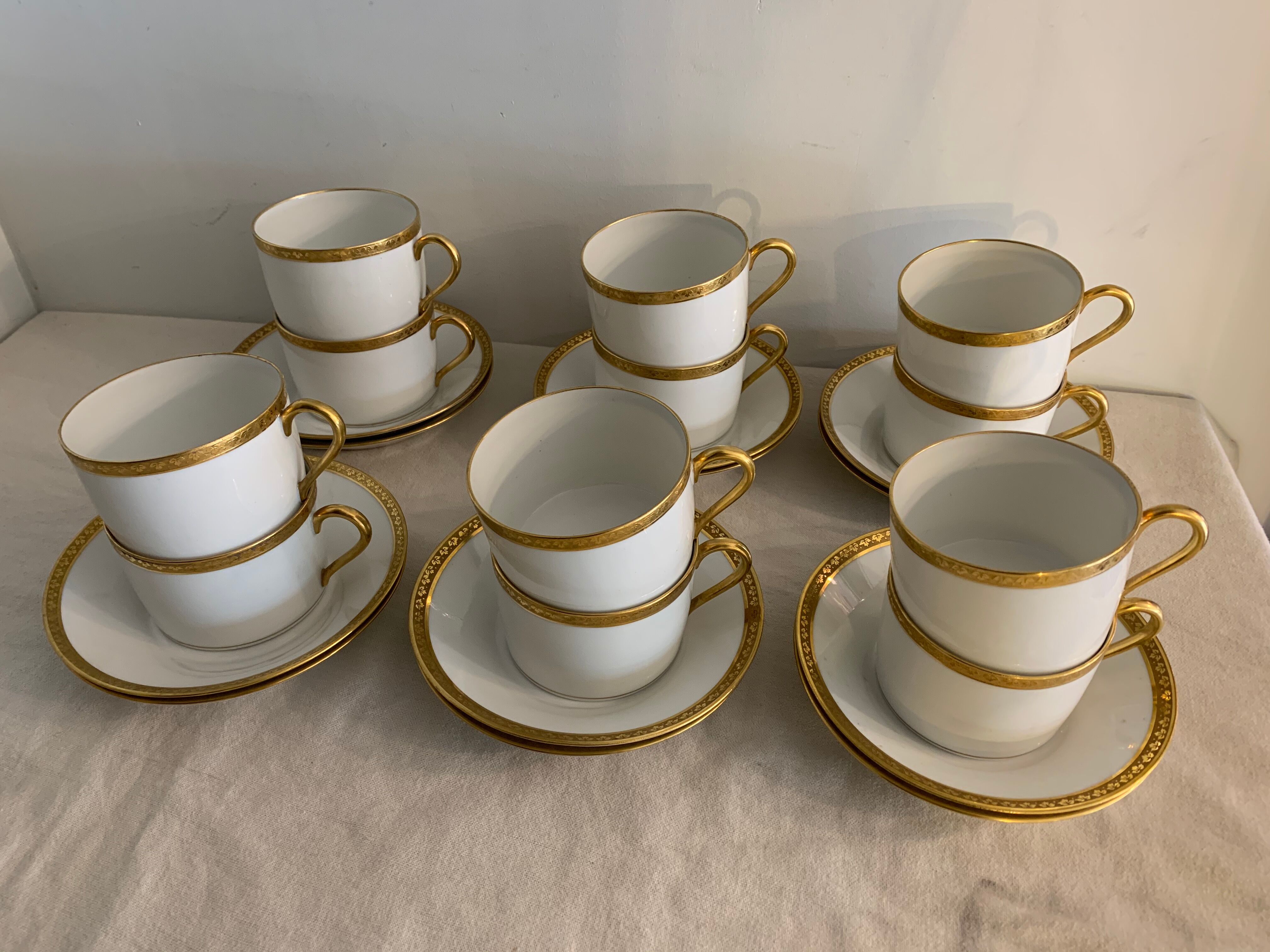 12 coffee cups and 12 white porcelain cups of Gold Gold Limoges