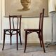 2 bistro chairs in arched and dark wood