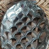 Silver-plated metal tray in the shape of a pineapple.