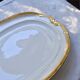 Large oval dish with gold trim in Limoges porcelain by Peconnet.
