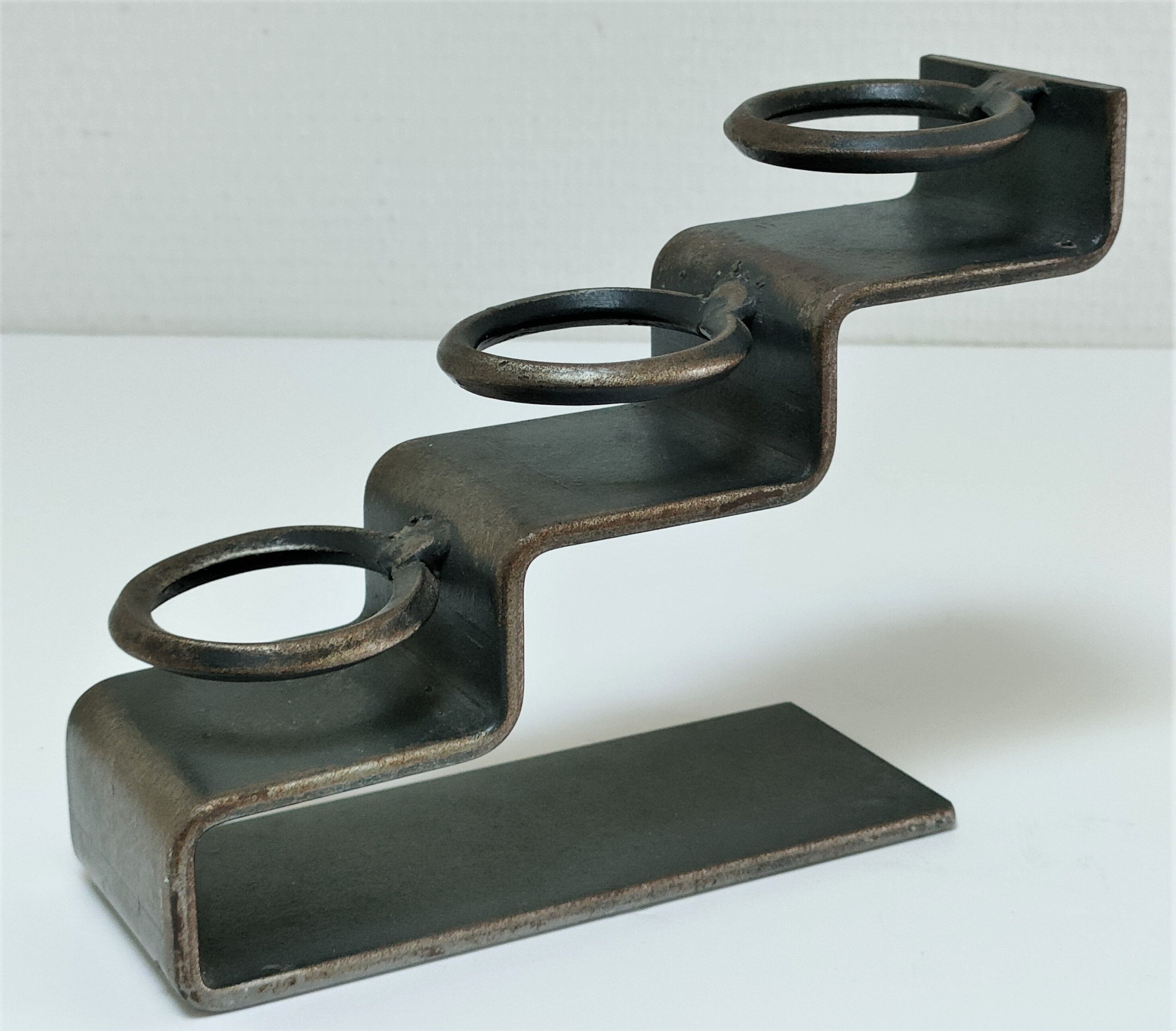 Sculptural candle holder patinated steel design 80s