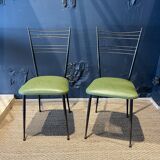 Pair of green vinyl chairs with black steel legs by Colette Gueden