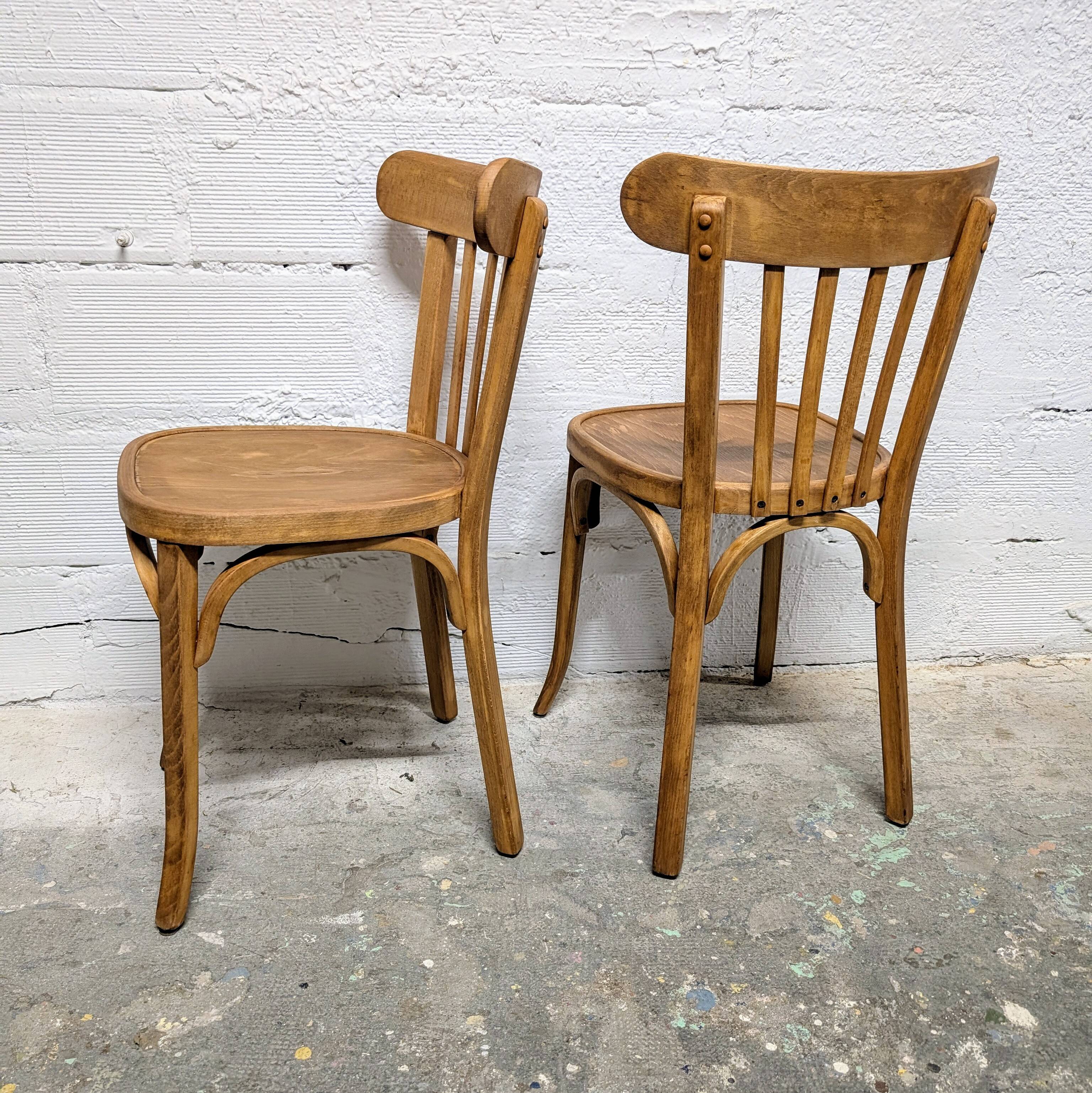 Duo of Baumann bistro chairs N°108
