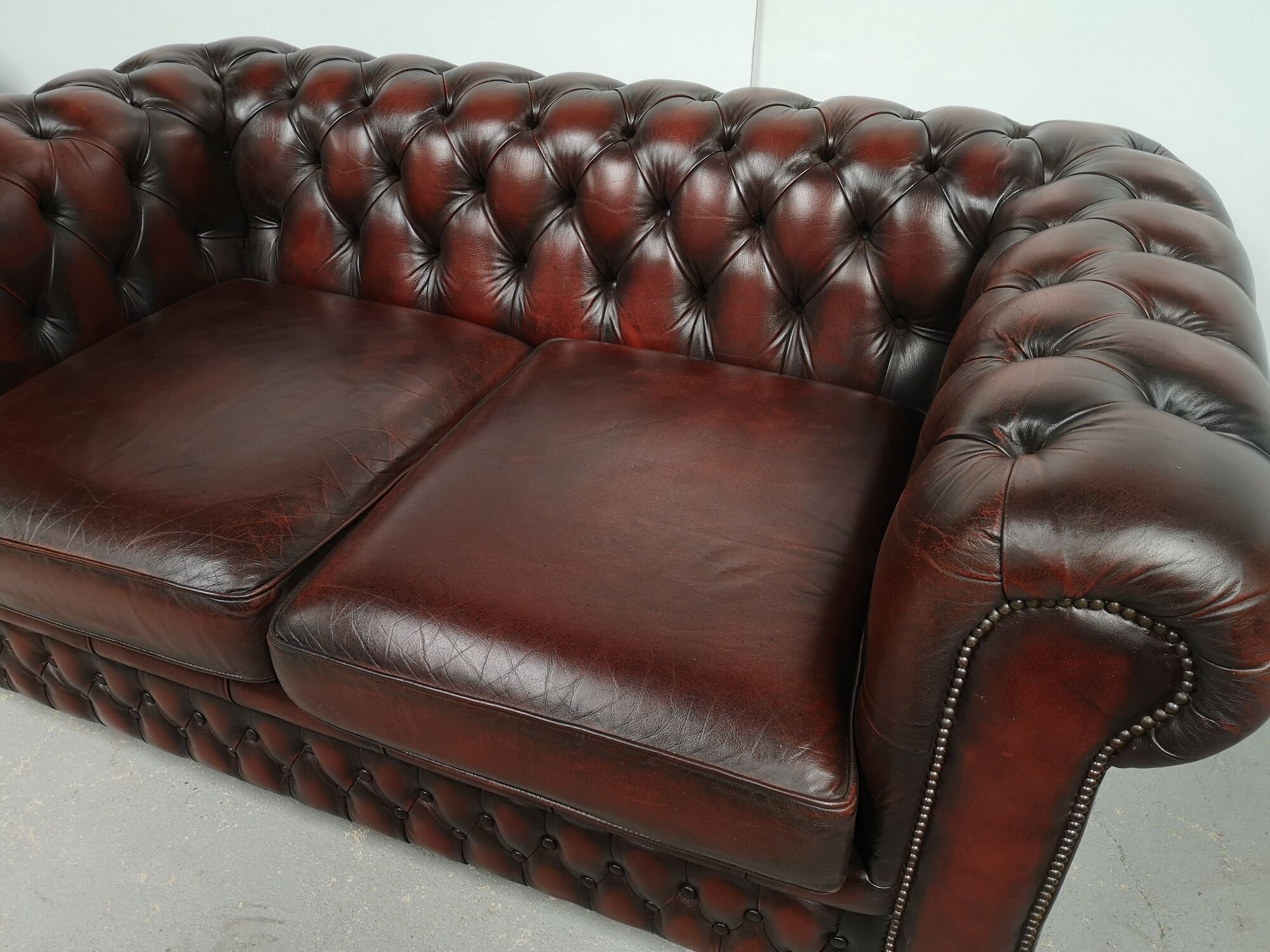 Convertible leather chesterfield sofa