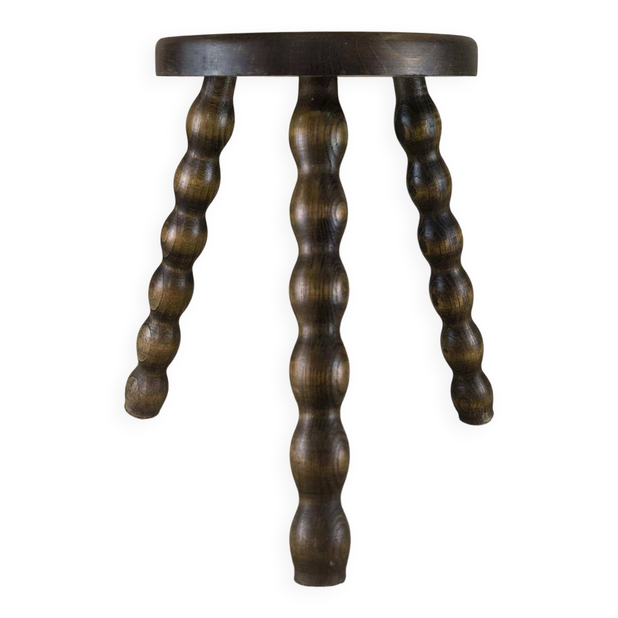 Small three-legged wooden stool with beaded feet.