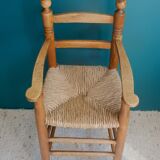 Children's high chair made of wood and straw