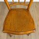 Pair of curved wood bistro chairs and studded and perforated seat