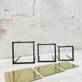 Suite of metal and glass nesting tables.