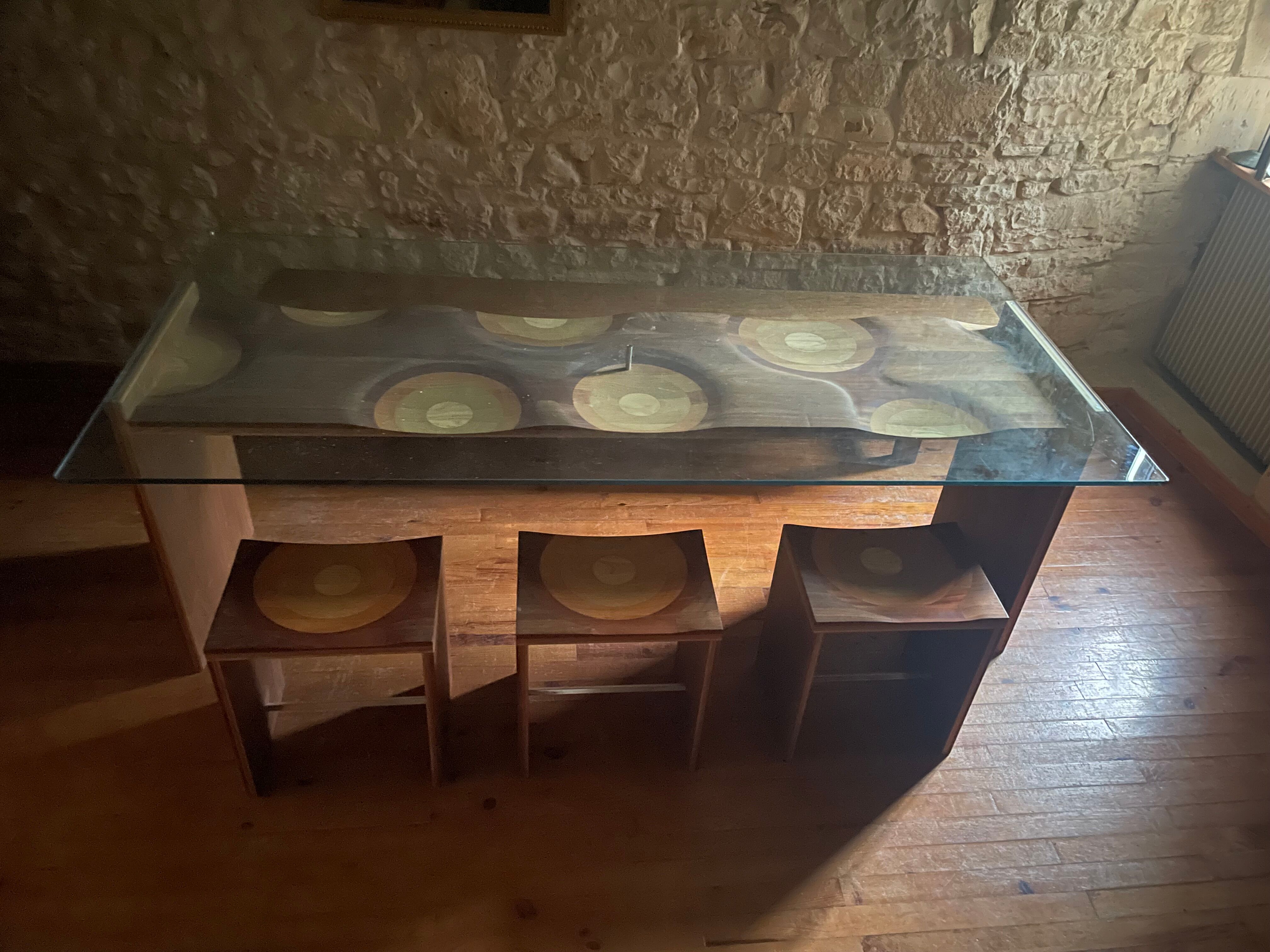 Dining table and 3 Ripples stools by Toyo Ito.