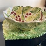 Cherry-decorated drainer fruit cup with its leaf-shaped dish