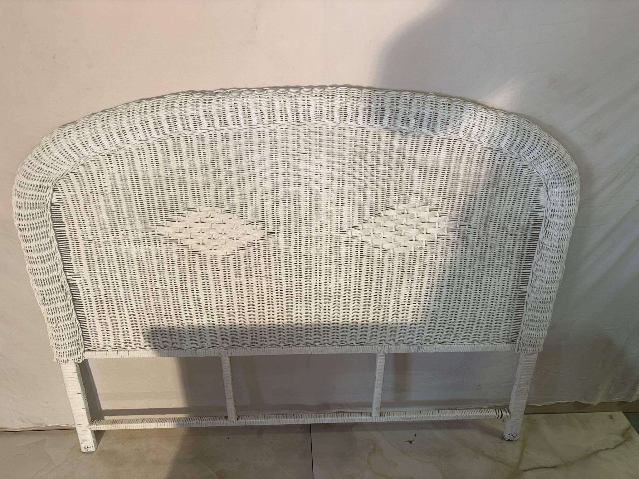 Vintage headboard in woven white rattan