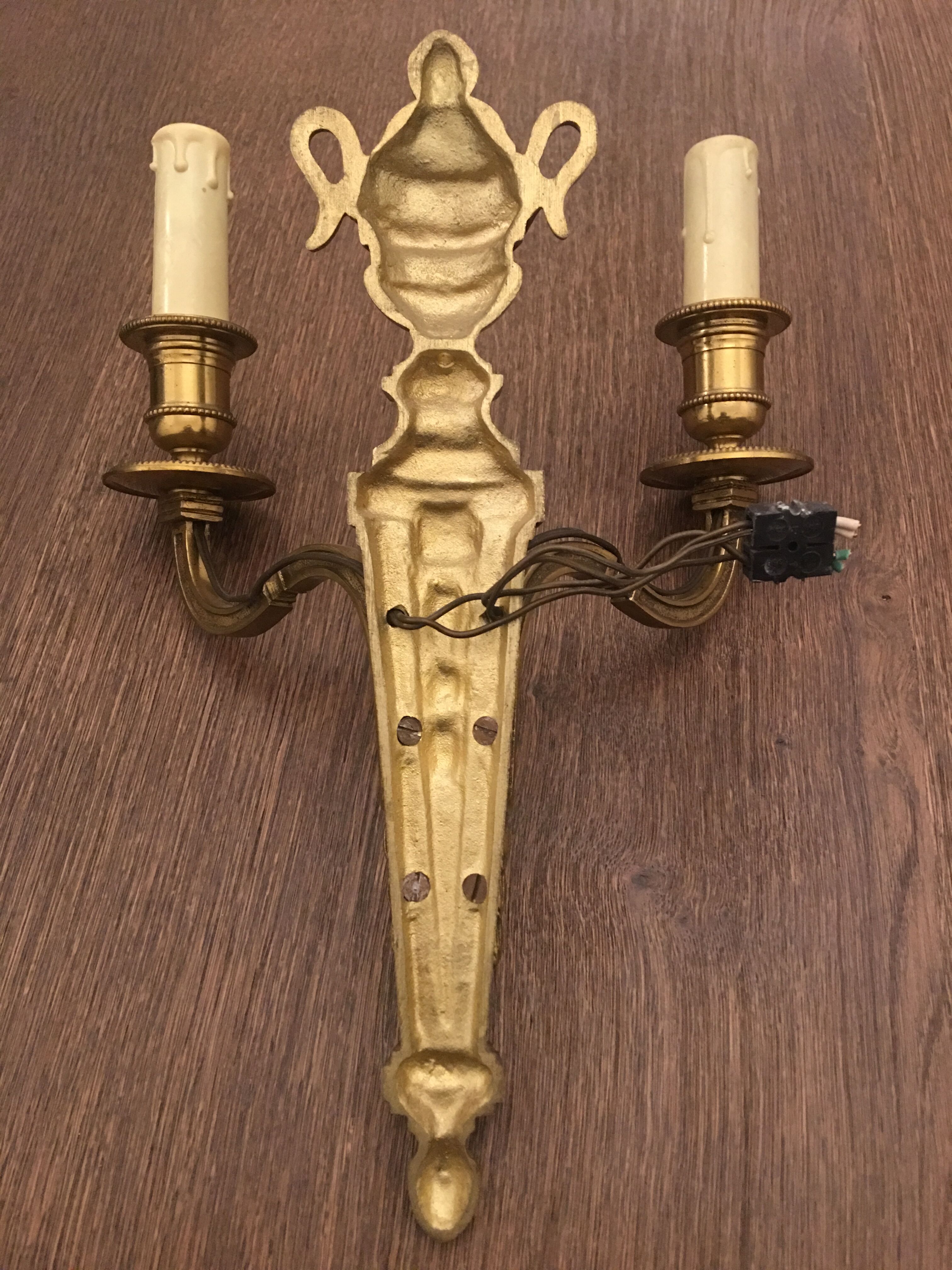 Eleven gilded bronze wall lamps