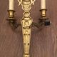 Eleven gilded bronze wall lamps