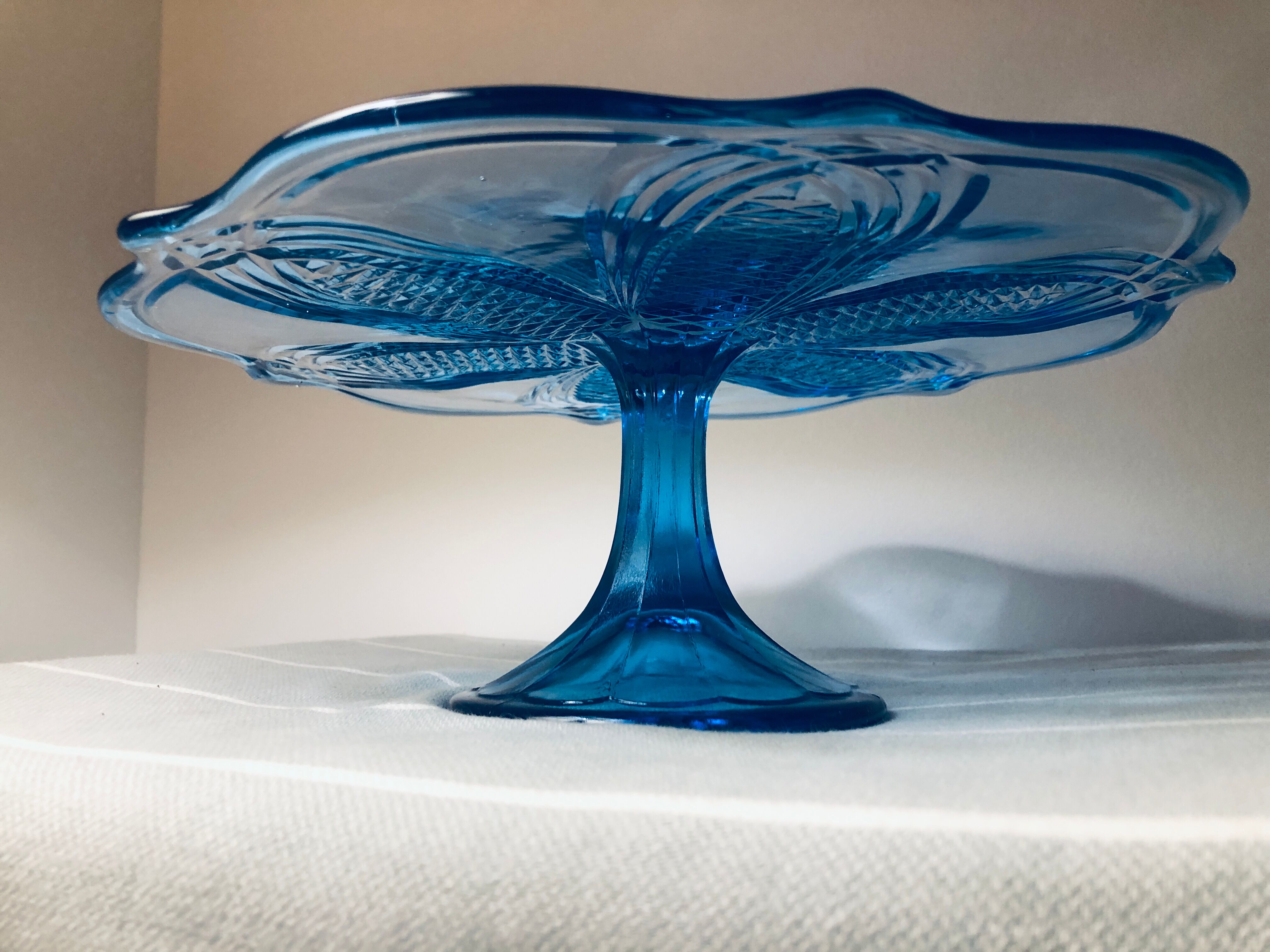 Blue vintage glass cake display