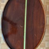 Table basse ovale en placage d’acajou