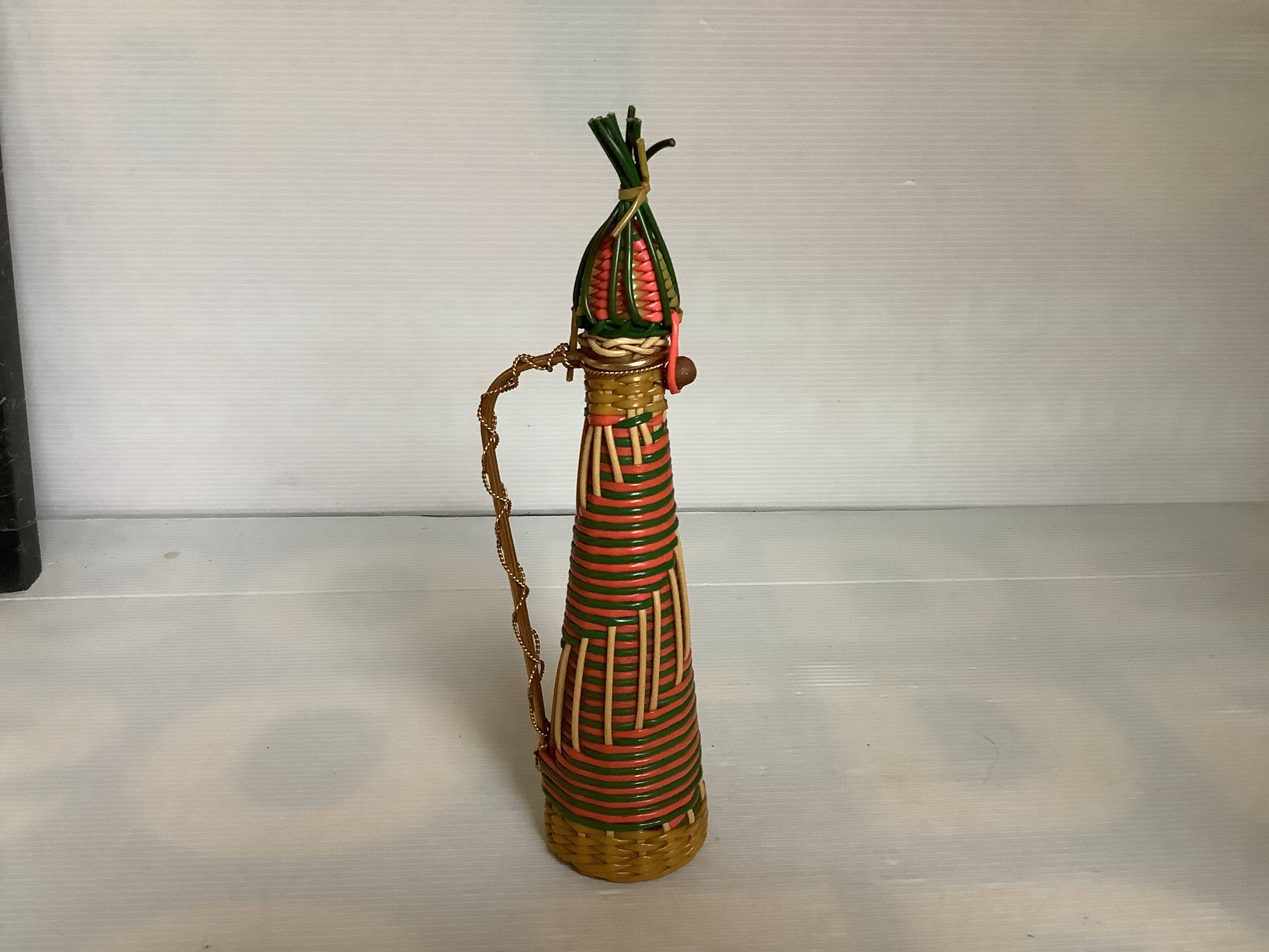 Multicoloured decorative mini bottle with gold metal.