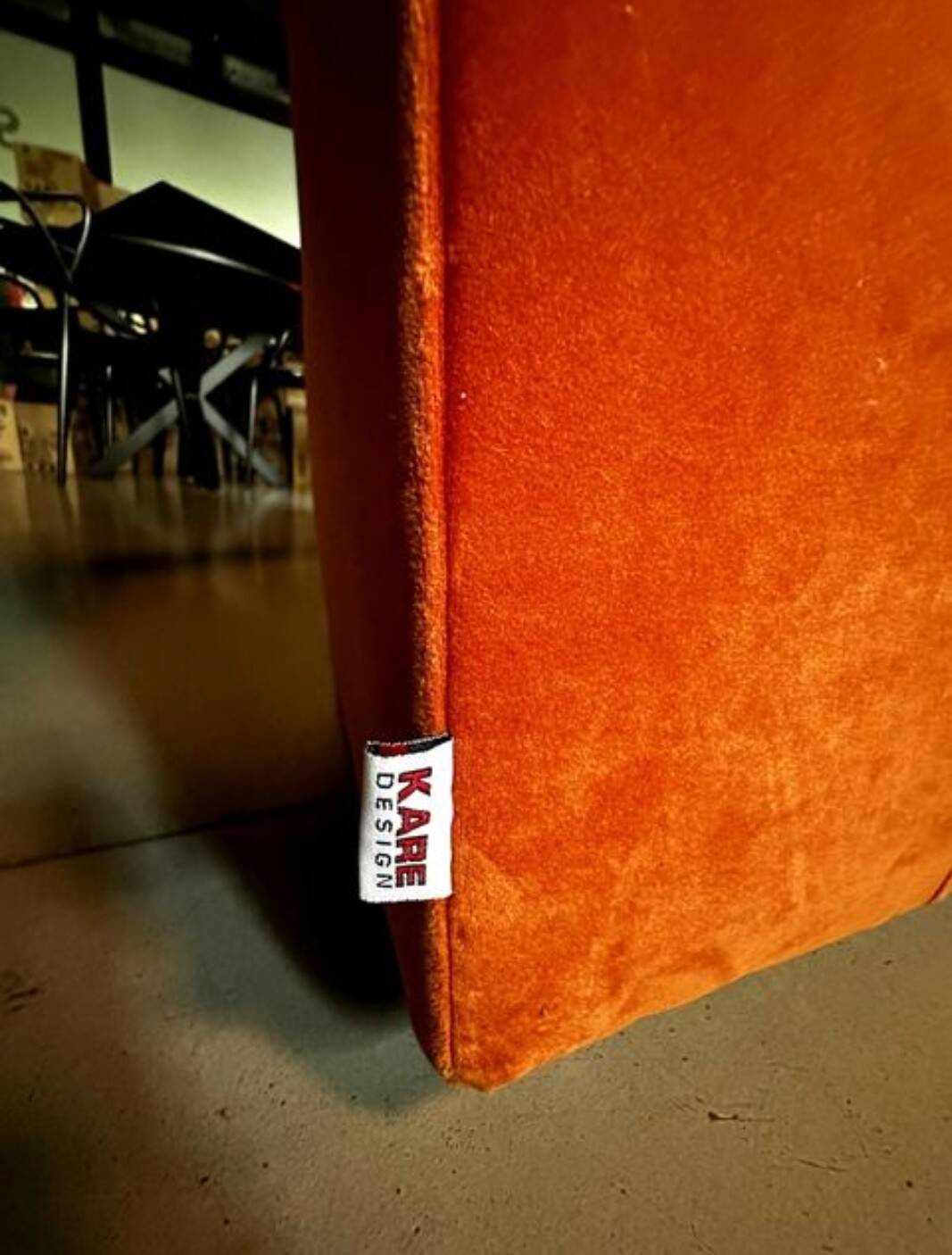 Burnt orange modular sofa for four with a futuristic design.