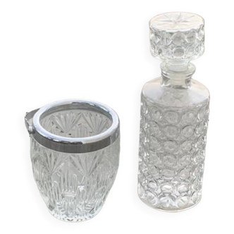 Whiskey decanter and ice bucket in transparent glass and vintage silver-colored metal handle