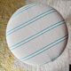 Vintage curved wooden stool in Baumann style, striped fabric seat.