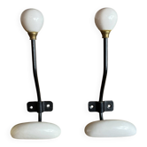 Pair of metal and porcelain hooks