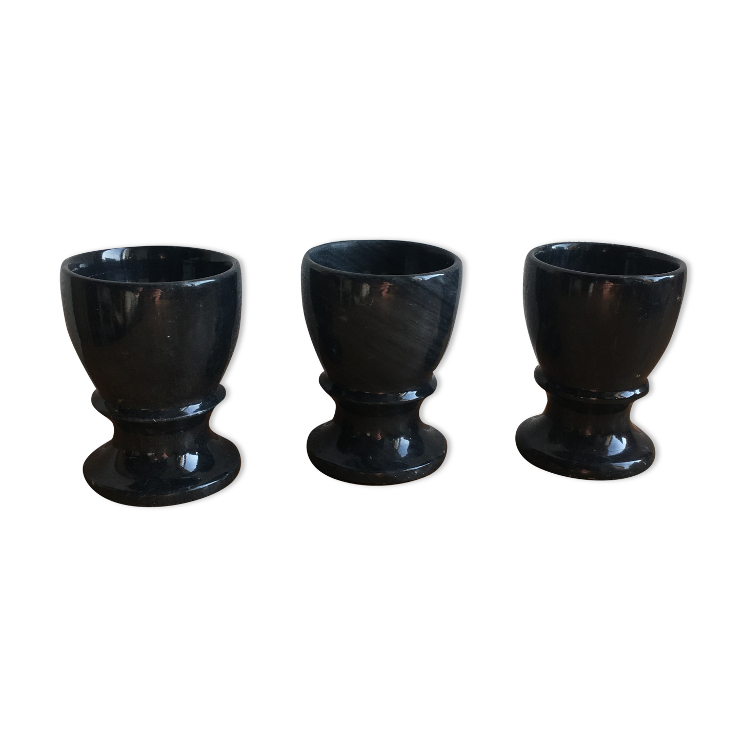 Trio of black marble cockroaches