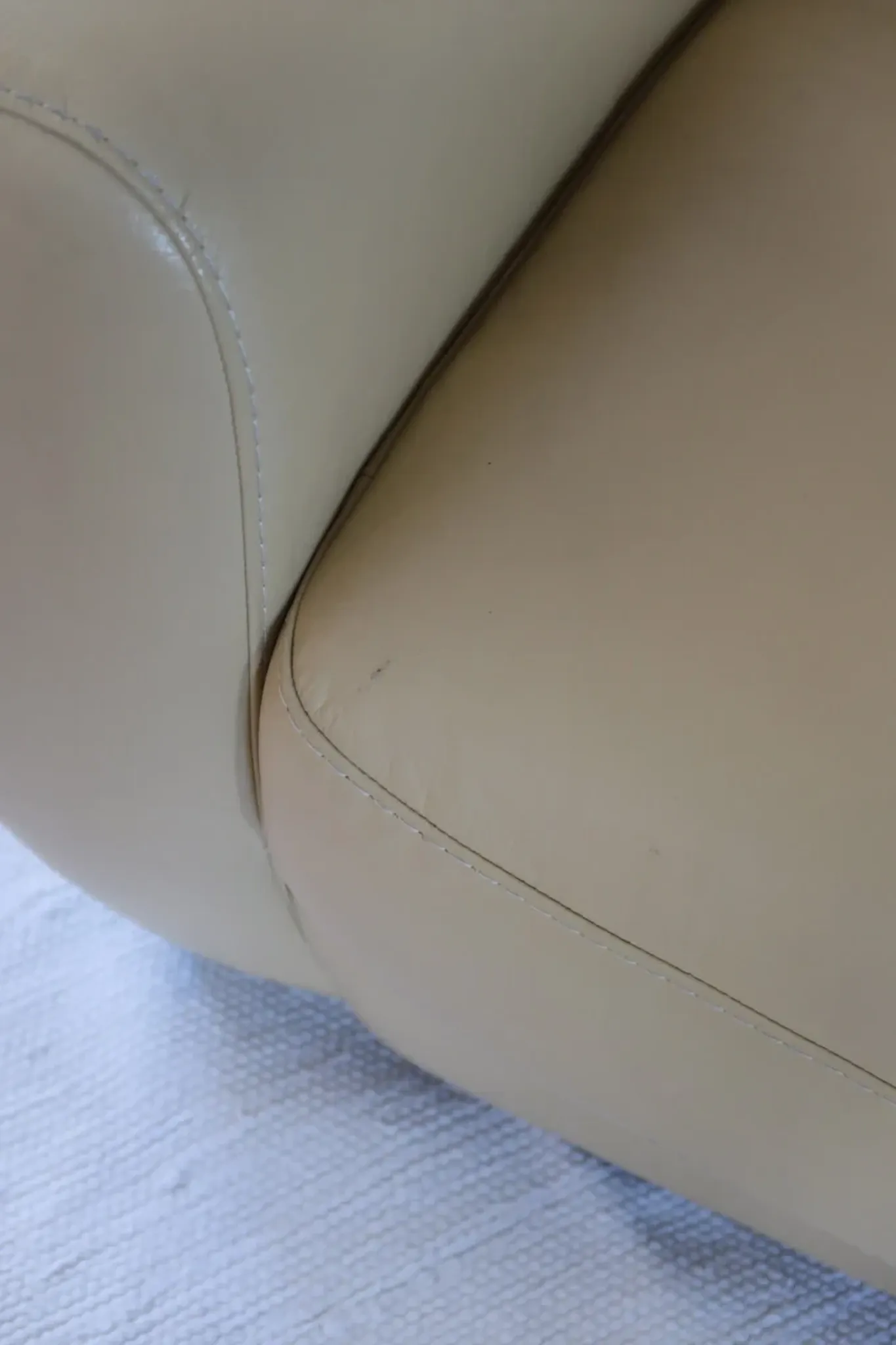 Vintage club armchair in butter yellow faux leather from the 1980s.